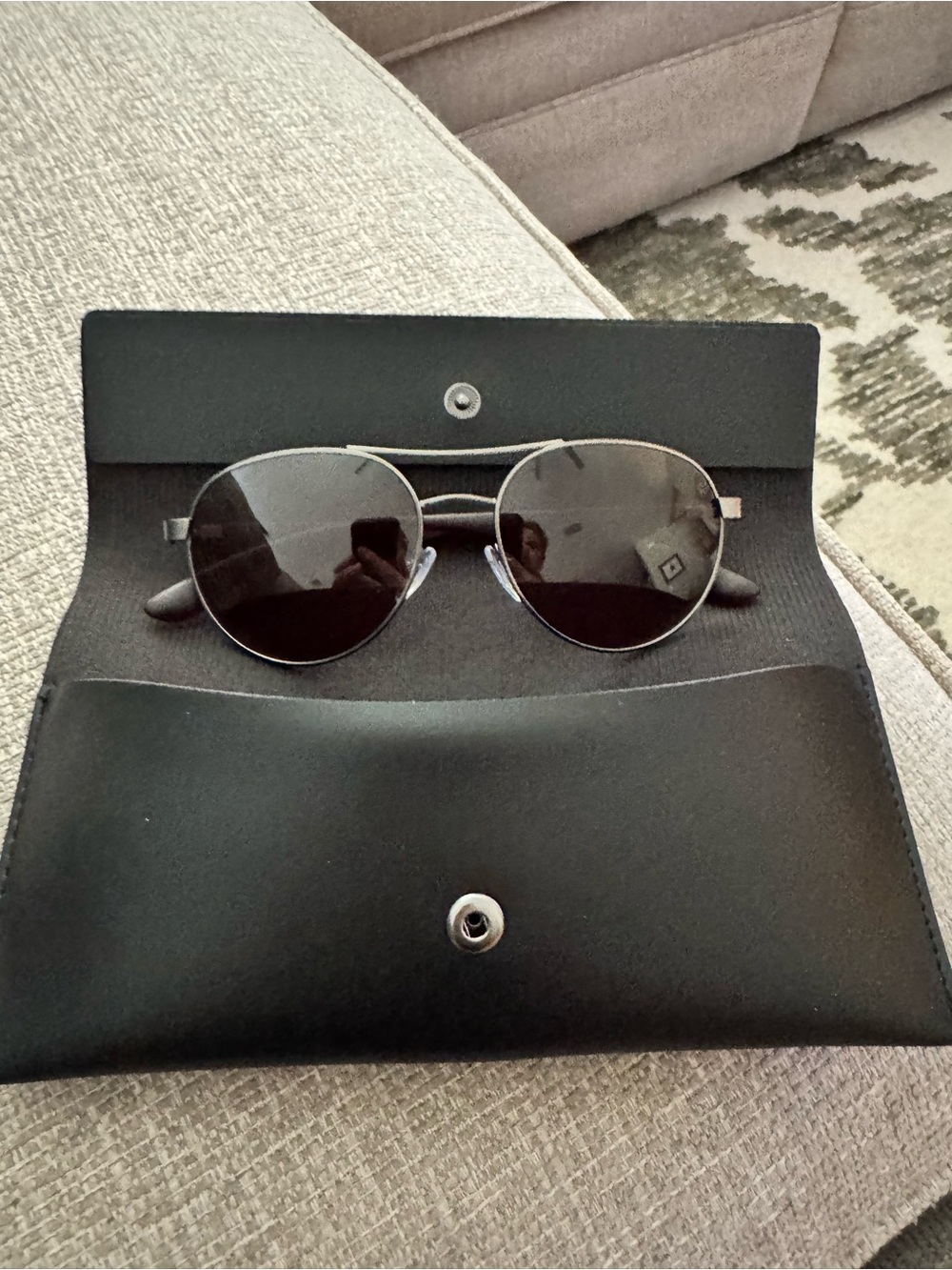 Calvin Klein Aviator Sunglasses with dark brown lenses.